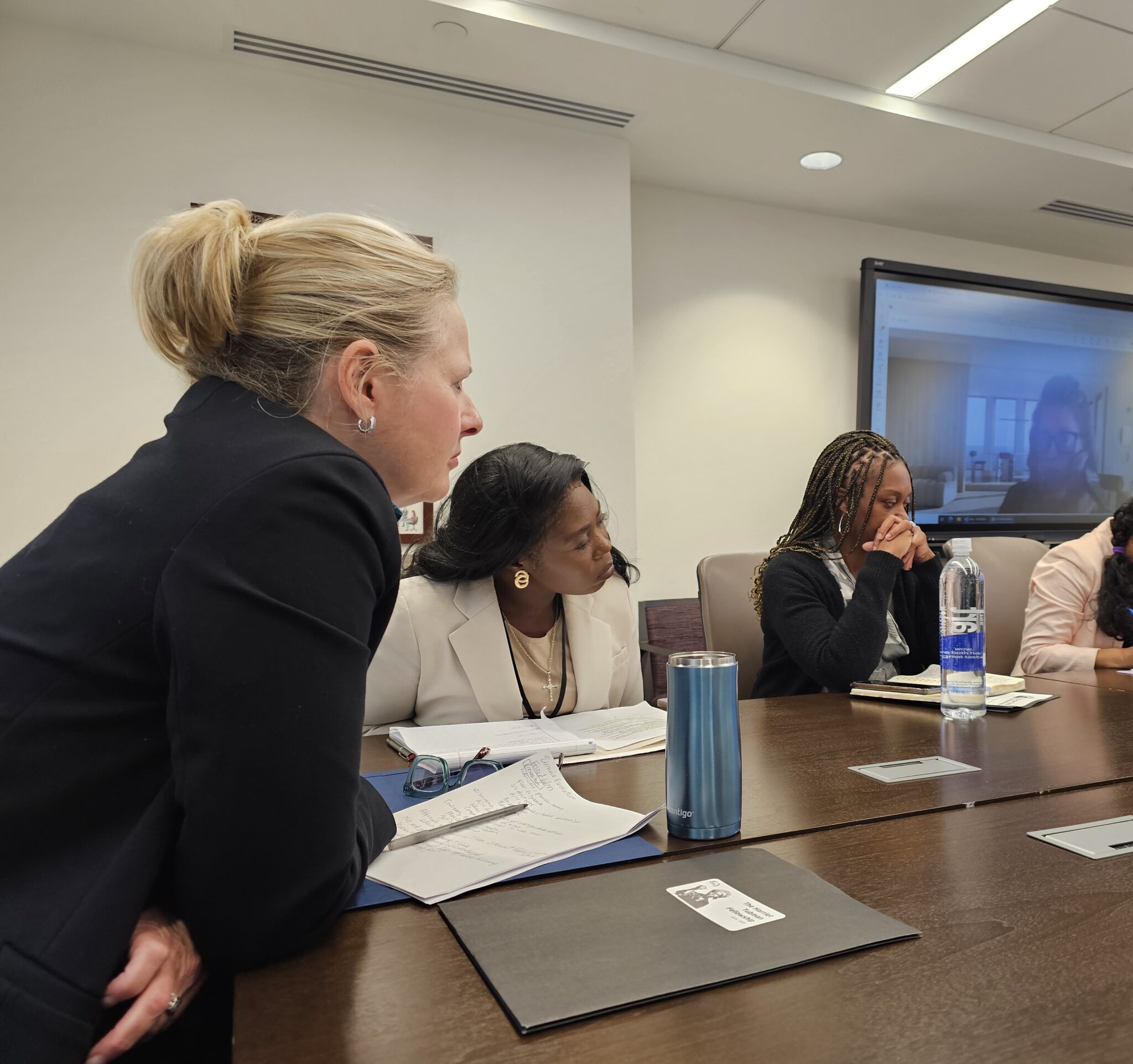 Fellow Grace N. Muwawa sits to the right of TIP Office Ambassador Cindy Dyer.