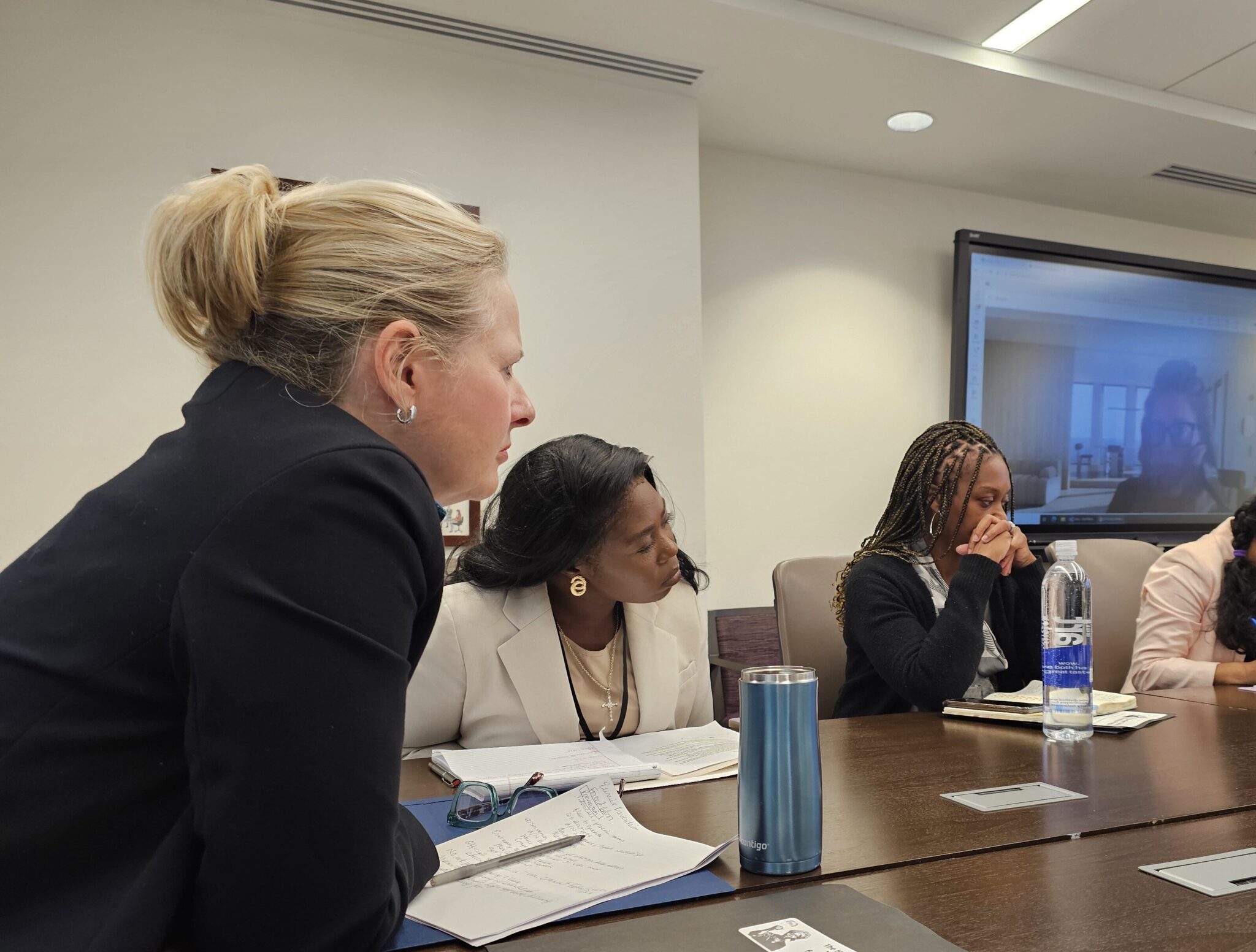 Fellow Grace Muwawa sits to the right of TIP Office Ambassador Cindy Dyer.