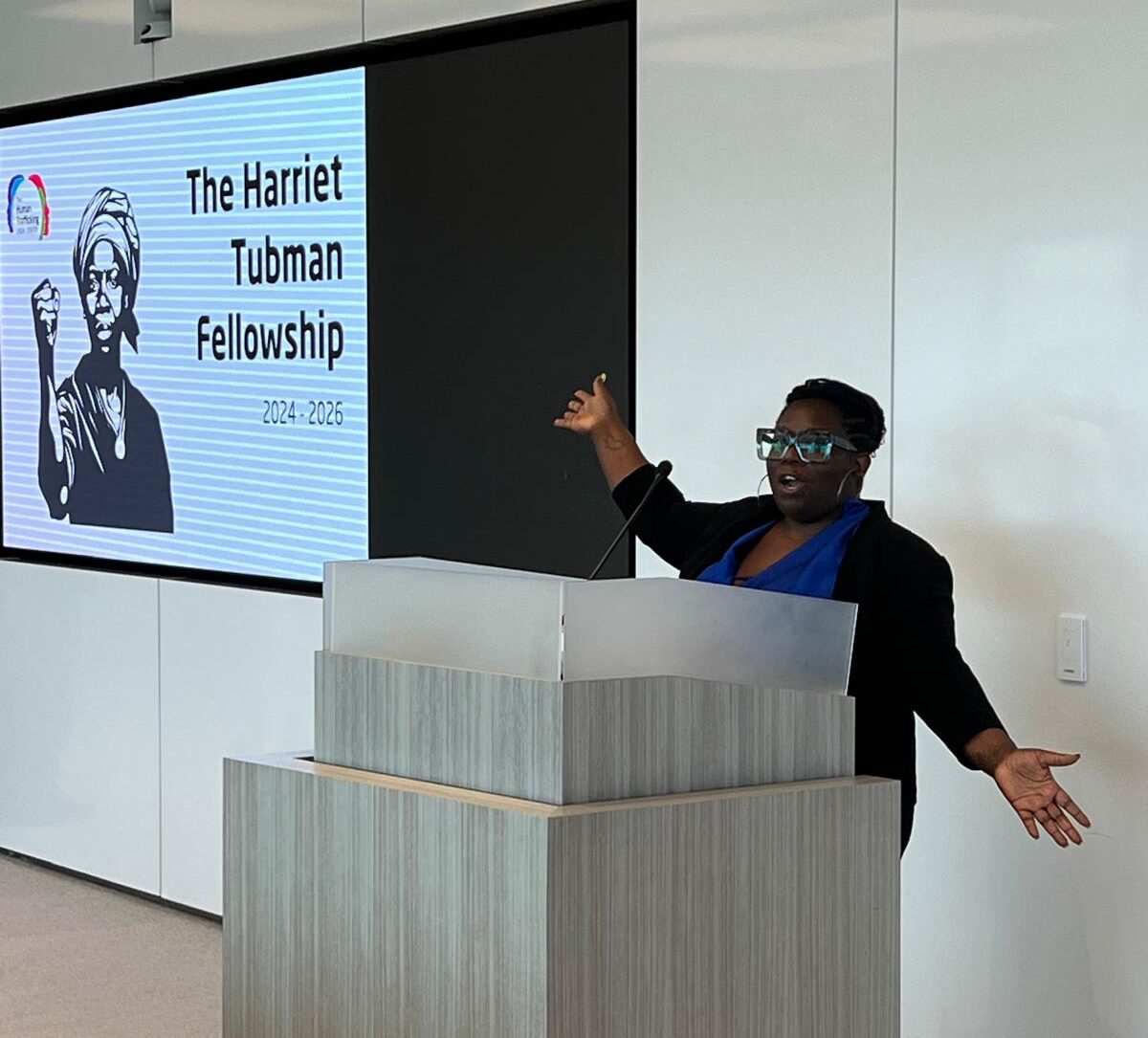 Evelyn Chumbow presents the Harriet Tubman Fellowship at the Advocacy Week Reception in August 2024.